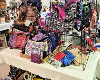 Large selection of purses, totes, wallets  and bags