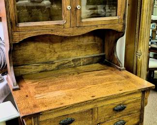 Very unique antique oak possum belly cabinet 