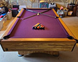 Pool table conveniently located by sliding glass door in walkout basement.