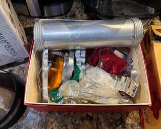 Vintage cookie decorator set with multiple cookie cutters and stamps