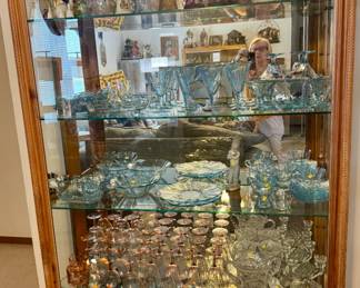 Case shows bell collection, blue Baroque Fostoria , pink depression and more