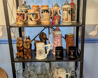 LOTS of Steins and Mugs - notice ceramic dogs on 3rd shelf down - love them!
