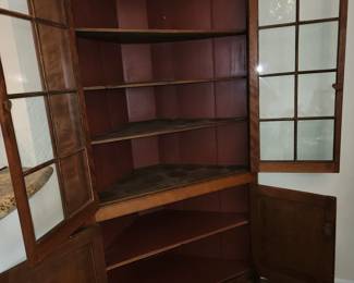 Antique corner cabinet, shelves have plate tracks