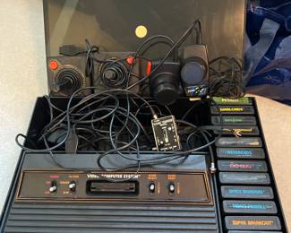 Vintage Atari 2600 Console, Joysticks, Paddles, Storage Unit, and 15 Games