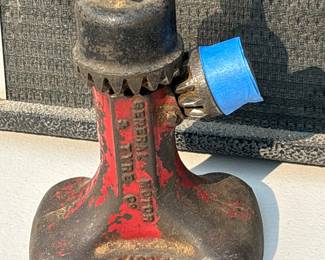 Antique General Motors and Tyre Cast Jack