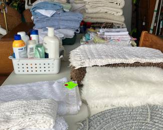 Assorted linens - full/ queen sheet sets, towels, kitchen sets. 