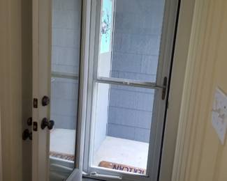 Full light entry door; storm door