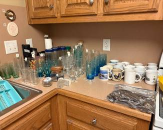 Kitchen - left corner next to sink - set of small “coca cola glasses in green”
