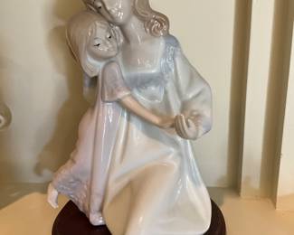 On mantle in living room - no label on girls