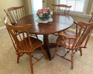 On mantle in living room - great wooden round table with 4 chairs
