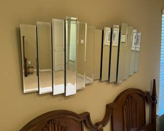 Mirror decor over headboard in master bedroom
