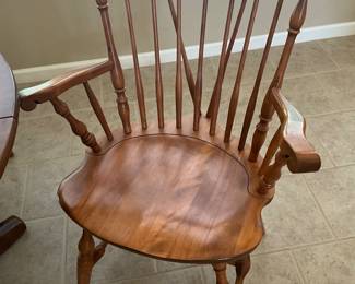 On mantle in living room - Close up of chairs to round table