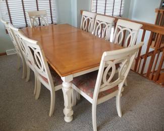 Dining set seats 8; shown with extra leaf in place