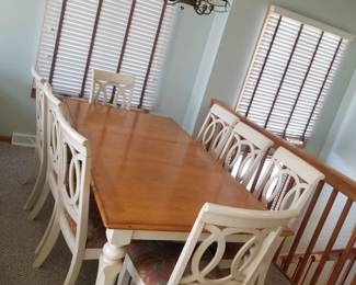Dining set seats 8; shown with extra leaf in place