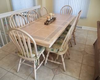 Dining table seats 8; shown with extra leaf in place. Tile top - indestructible!