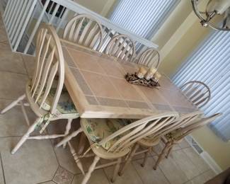 Dining table seats 8; shown with extra leaf in place. Tile top - indestructible!