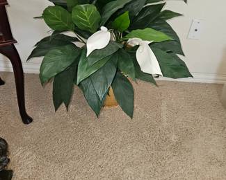 Faux plant with white blooms