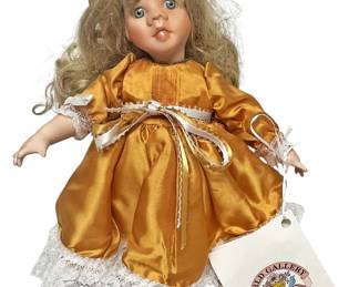 World Gallery Porcelain Doll in Gold Dress