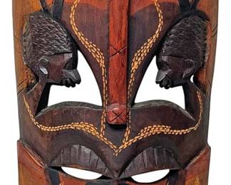 Carved Tribal Mask with Side Profiles