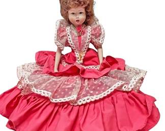 Sitting Doll in Layered Pink Dress