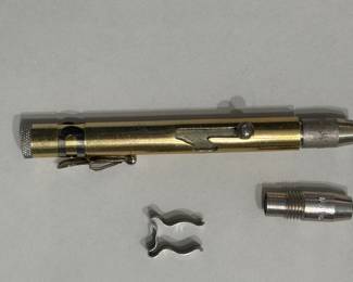 Vintage 1960’s PenGun. The PenGun might actually date from the WWII era but the bullets are from 1968. The “bullet” is a teargas bullet. Has one blank teargas bullet and one “live” bullet. Cool piece of history.