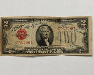 1928 D $2.00 Bill signed by a group of WWII Army Vets on the front. On the back different bases are listed: Laredo Army Air Field(LAAF), Camp Beauregard, Sheppard Field TX, and a couple of others.