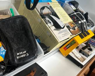 Tons of camera, camera equipment, chargers, clock radios, cell phones.