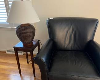 Another shot of the wicker lamps and a beautiful leather chair in excellent condition