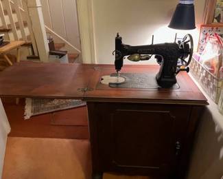 Looking at the White Family Rotary Sewing Machine with the table top extended