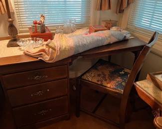 Showing the storage and drop leaf open of the sewing table 