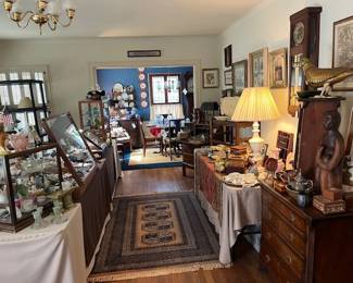 Looking down the front room into the dining room, full of great items