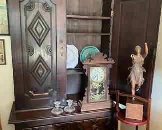 Antique highly carved cupboard with storage and a lower drawer, vintage mantle clock, bronze statue as is!