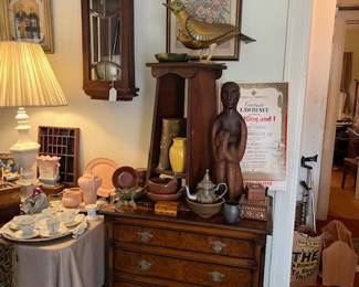 Antique Gentleman's chest of drawers, handmade plant stand, handmade wood sculpture, handmade paper mache bird, and handmade pottery