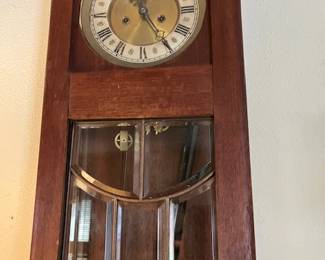Antique wall clock with beveled glass