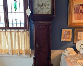 This Grandfather clock is wonderful. Made by Winstley, Holywell, England, hand painted metal face and a tiger oak case