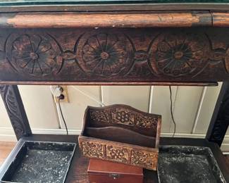 A close look at the hand carved details of the umbrella stand