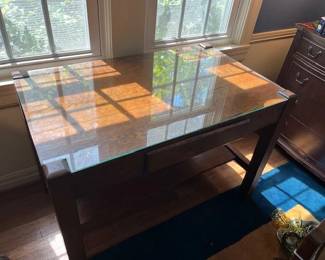 The table has a custom fitted glass top