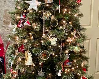 7’ LIGHTED CHRISTMAS TREE ON PLATFORM WITH CASTORS. (ORNAMENTS PRICED SEPARATELY)