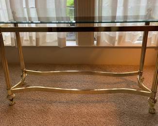 Glass top brass finish base sofa table. 26”x48”x14”HxWxD. $50 price mark down 