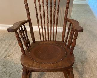 Antique oak spindle back leather seat rocker. 36”x23”x31” HWD overall $100