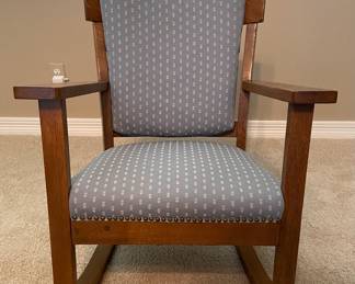 Antique Mission oak upholstered rocking chair. 36” H (at back) x27” W (across arms) x 33” D (base) $400. 