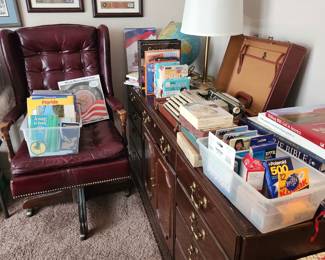 Office chair and credenza, portable manual typewriter, light up globe, language books, military art, ephemera