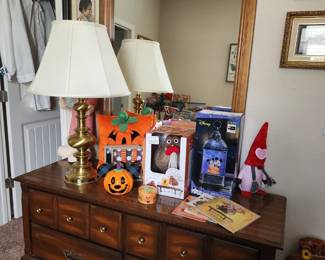 Dresser with mirror, brass lamp, seasonal decor