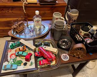 Bug alarm clocks , shoe shining kit , coke toys, shaving , cedar chest