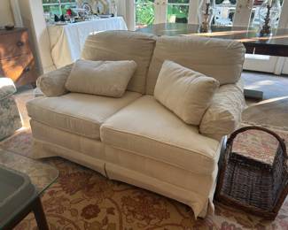 White settee. Covered the same as curved sofa in living room