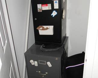 Safe with key and file cabinet