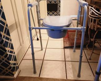 New (never uses) bedside commode 