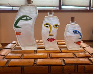 Glass faces on bottles. 