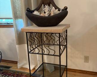 Heavy duty limestone table with metal statue. These are two different piece that are for sale. 