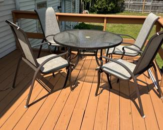 Round outdoor glass iron table with 4 sling chairs 